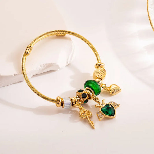 Pulsera Dorada Verde Corazón Alas Llave