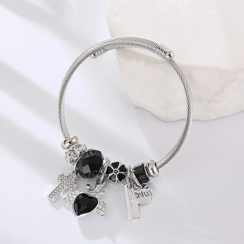 Pulsera Cruz Corazón Alas Negro